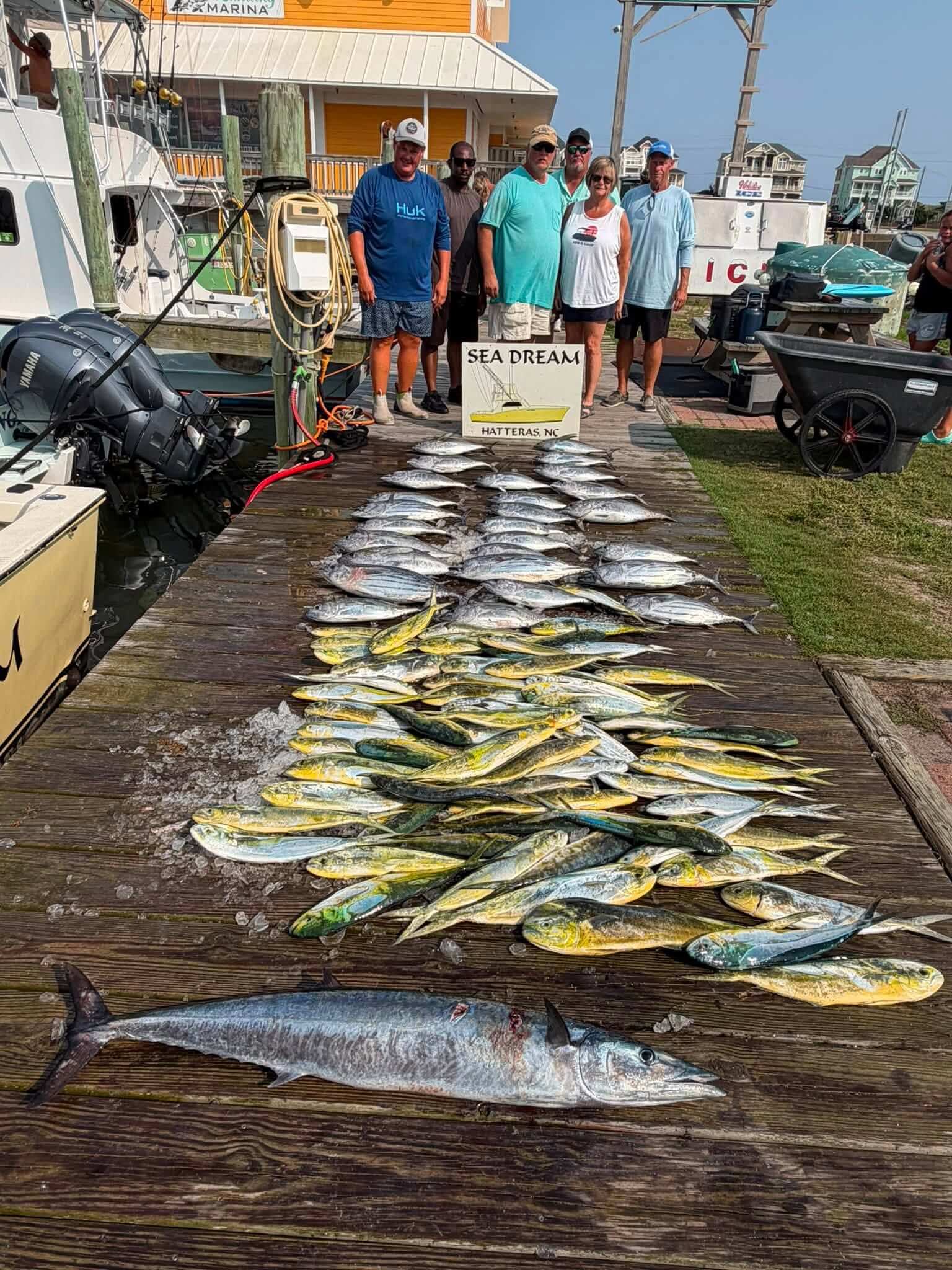 Sea Dream group standing behind a spectacular day's catch.