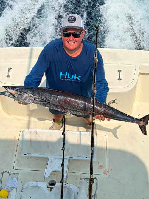 Sea Dream customer holding up nice wahoo.