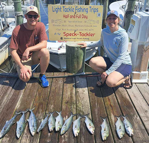 Pamlico Sound light tackle anglers showing off their catch of bluefis and spanish mackerel.
